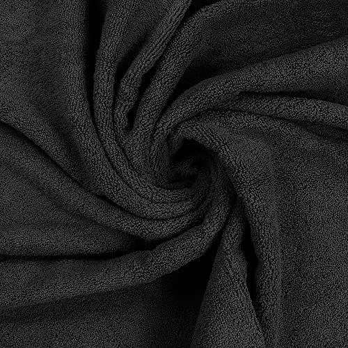 Black Utopia Towels set in lifestyle arrangement